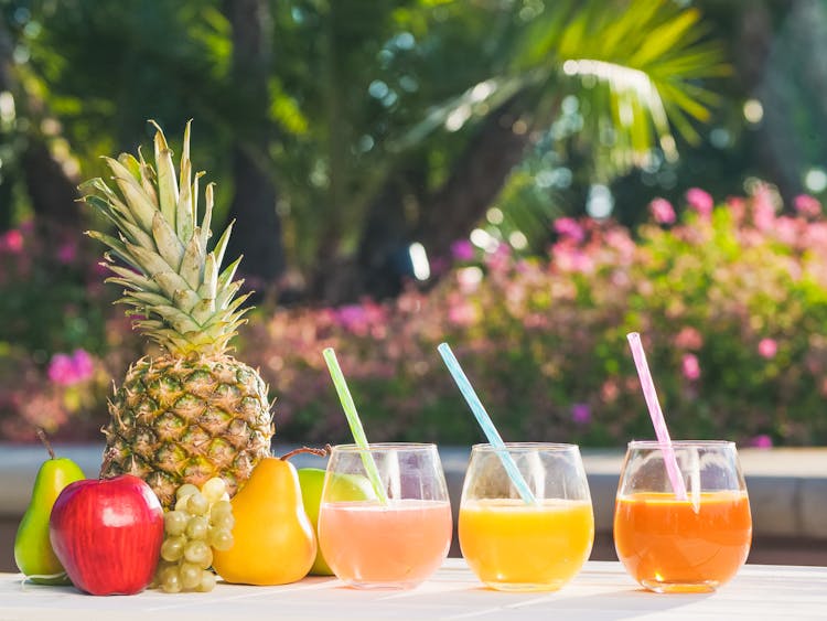 A Variety Of Fruit Juices On A Table 