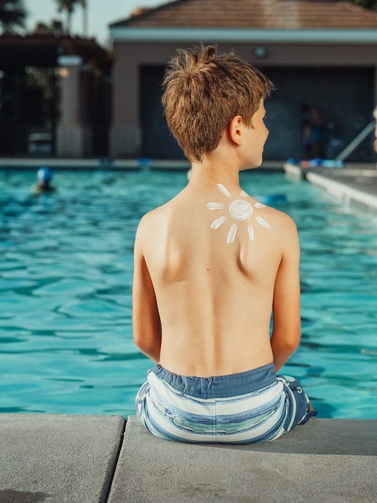 A Boy With A Sun On His Back