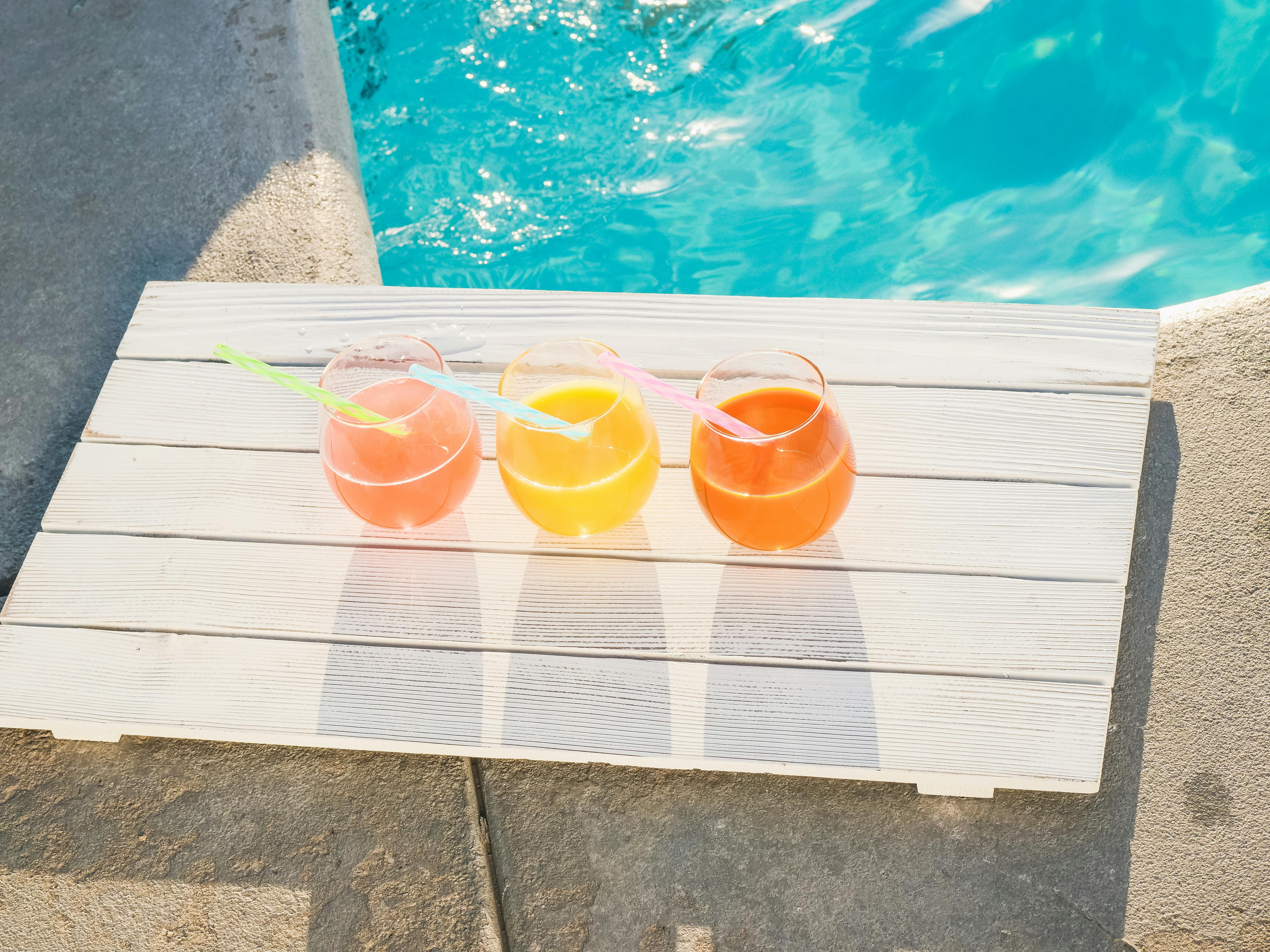 fresh cold pressed juices on a wooden plank