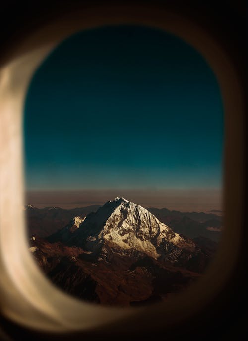 View of the Snow Covered Mountain from the Window Plane