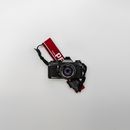 Black and Gray Pentax Bridge Camera on White Surface