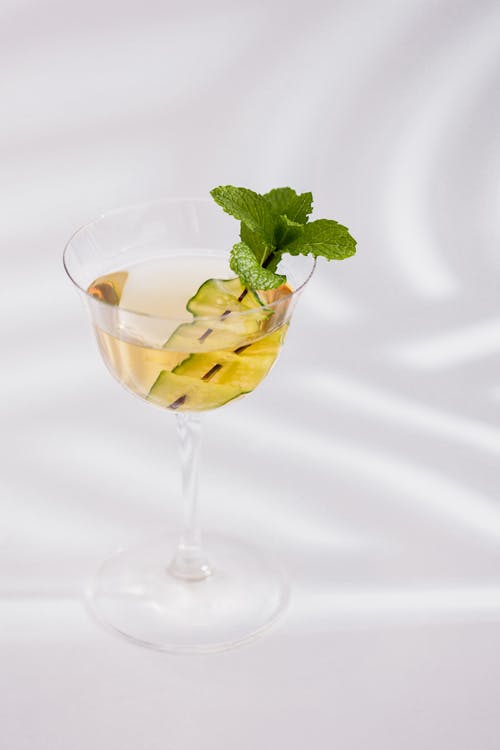A Cocktail Drink Garnished with Mint Leaves