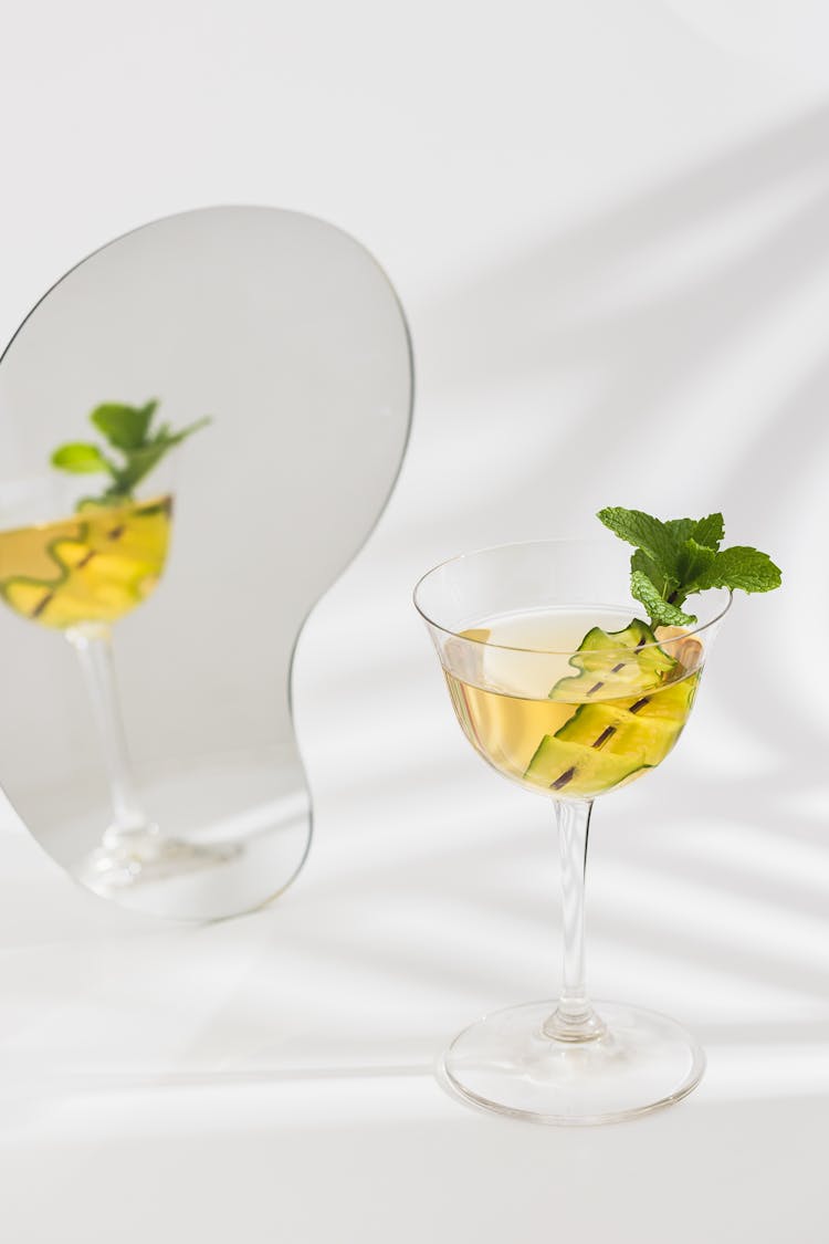 Mint Leaves And Cucumber Garnish On A Cocktail Drink