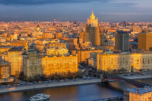 Stunning aerial view of Moscow showcasing classic architecture and vibrant city life at sunset.