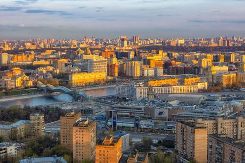 Free A breathtaking aerial view of Moscow cityscape featuring vibrant architecture illuminated by sunset hues. Stock Photo