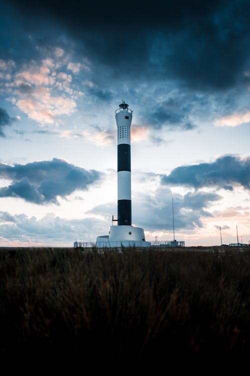 White and Black Tower Uncer Gray and White Clouds