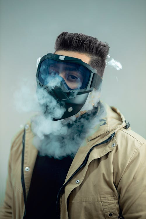 Free Smoke around a Person Wearing a Gas Mask Stock Photo