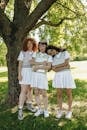 Young Women Posing by a Tree
