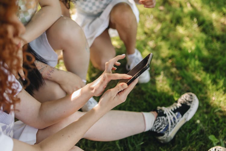 Side View Of A Person Using A Cellphone