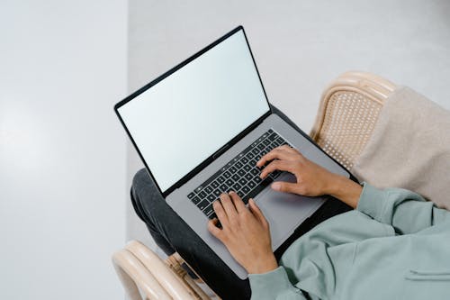 Overhead Shot of a Person Using a Laptop
