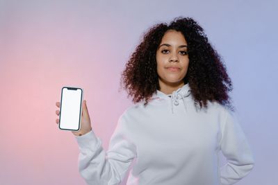 Person showing a smartphone screen — photo by MART PRODUCTION on Pexels