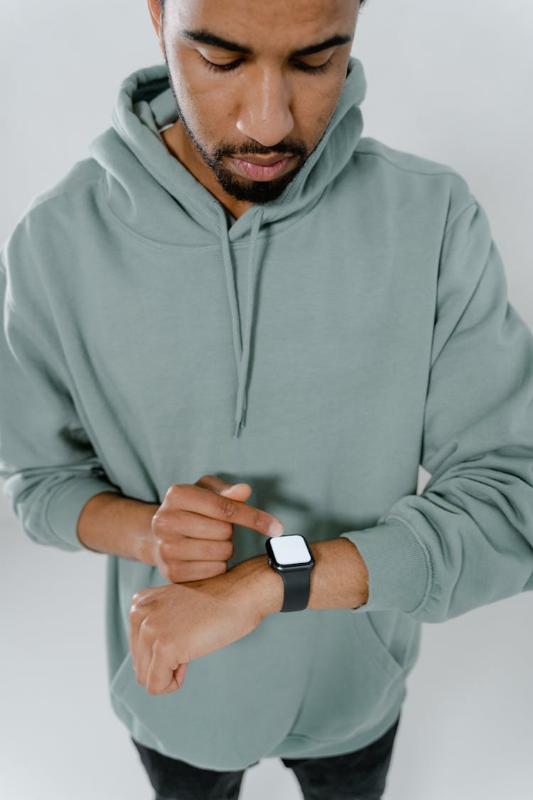 Man In Hoodie Wearing Smartwatch