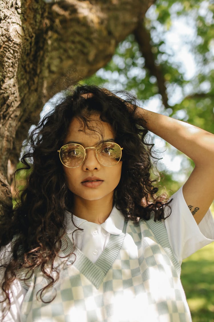 Woman In White Polo Shirt Wearing An Eyeglasses