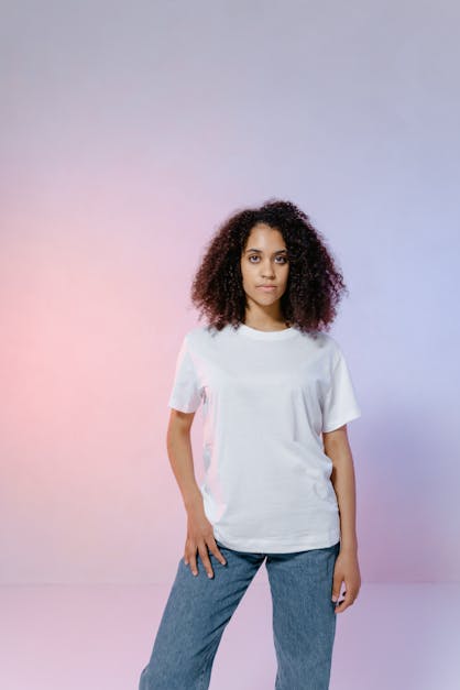 An Afro-Haired Woman in White Shirt Standing · Free Stock Photo