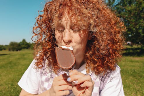 A Woman Eating Popsicle