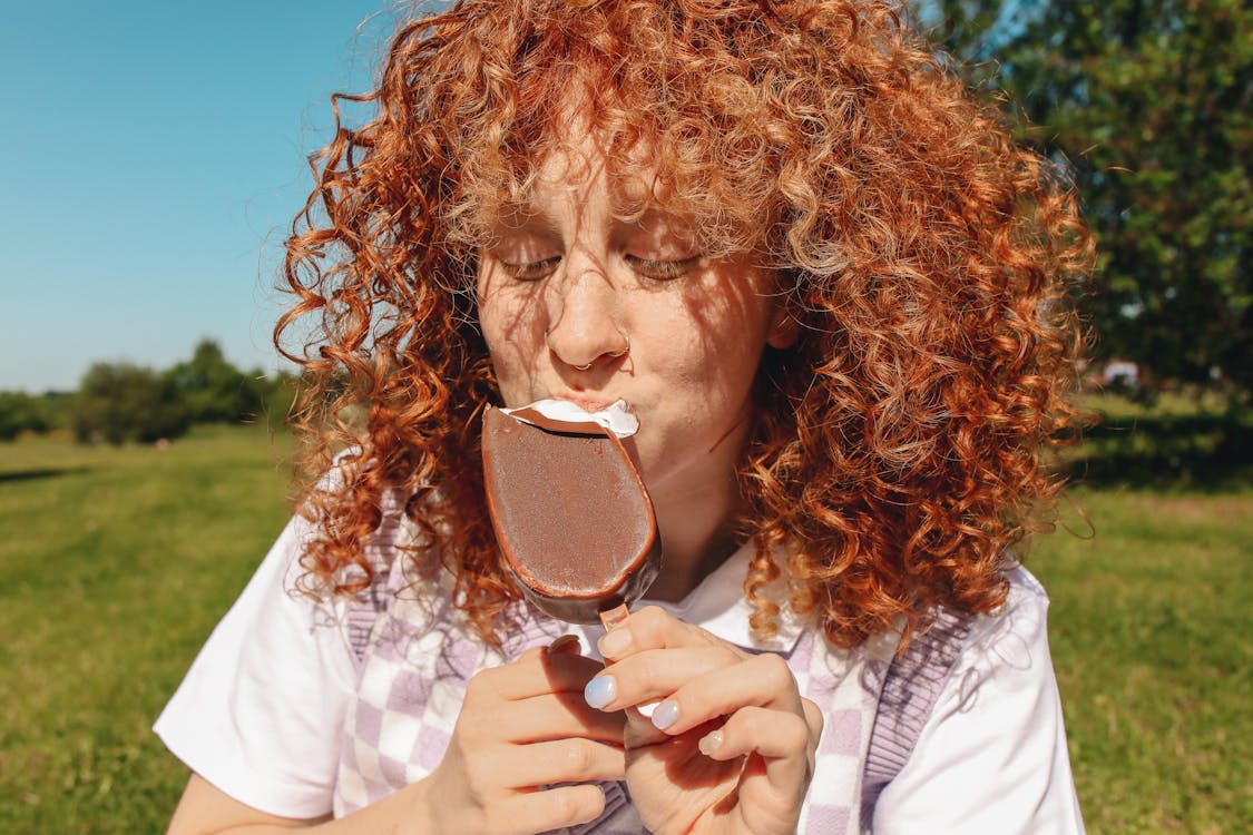A Woman Eating Popsicle