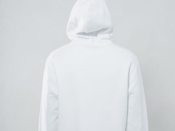 Back view of a person wearing a white hoodie jacket