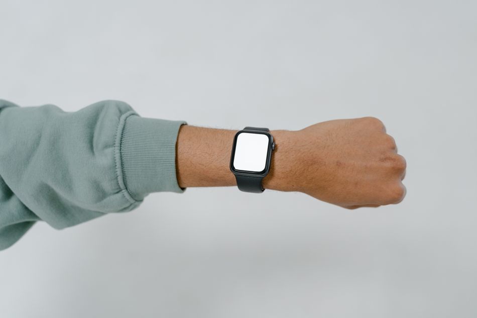 A smartwatch worn on the wrist. Photo by MART PRODUCTION on Pexels