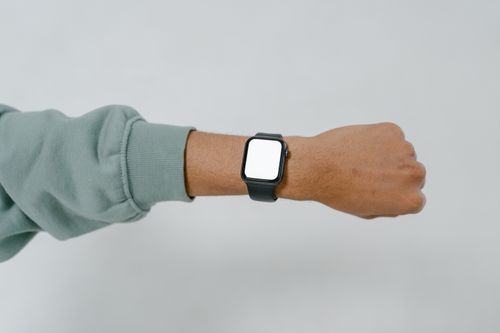 Free A close-up view of a smartwatch with blank screen on an adult's wrist, ideal for mockup designs. Stock Photo