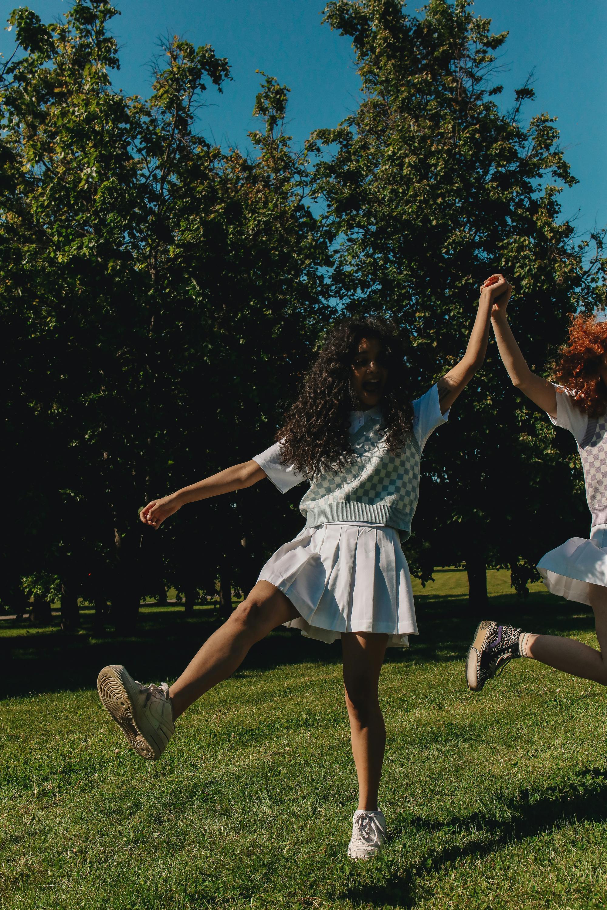 Woman Wearing Sweater Vest and White Skirt · Free Stock Photo