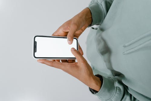 Close-Up Shot of a Person Holding a Smartphone