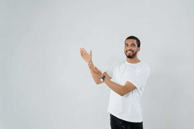 A Bearded Man Wearing A Plain White Shirt