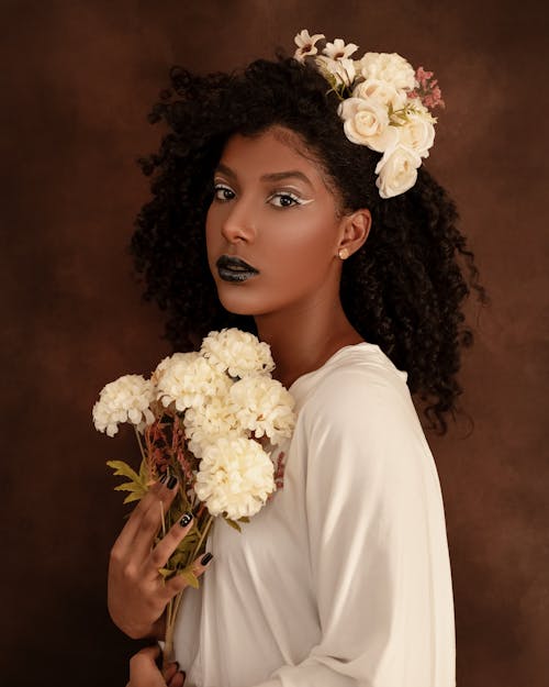 A Beautiful Woman with White Flowers on Hair