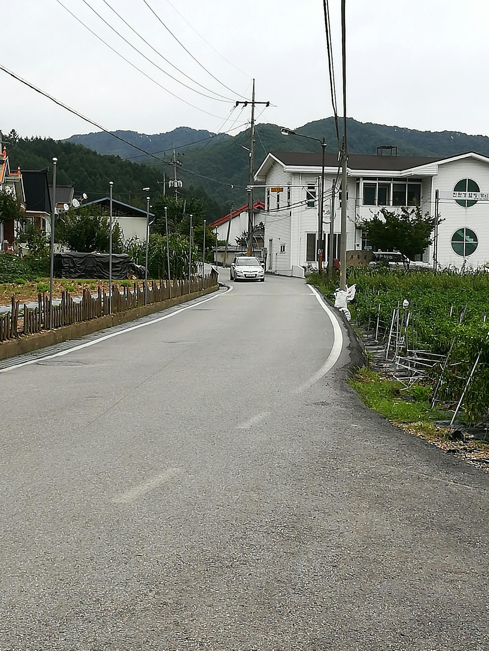 Person holding a remote control, selecting a series from a streaming service menu