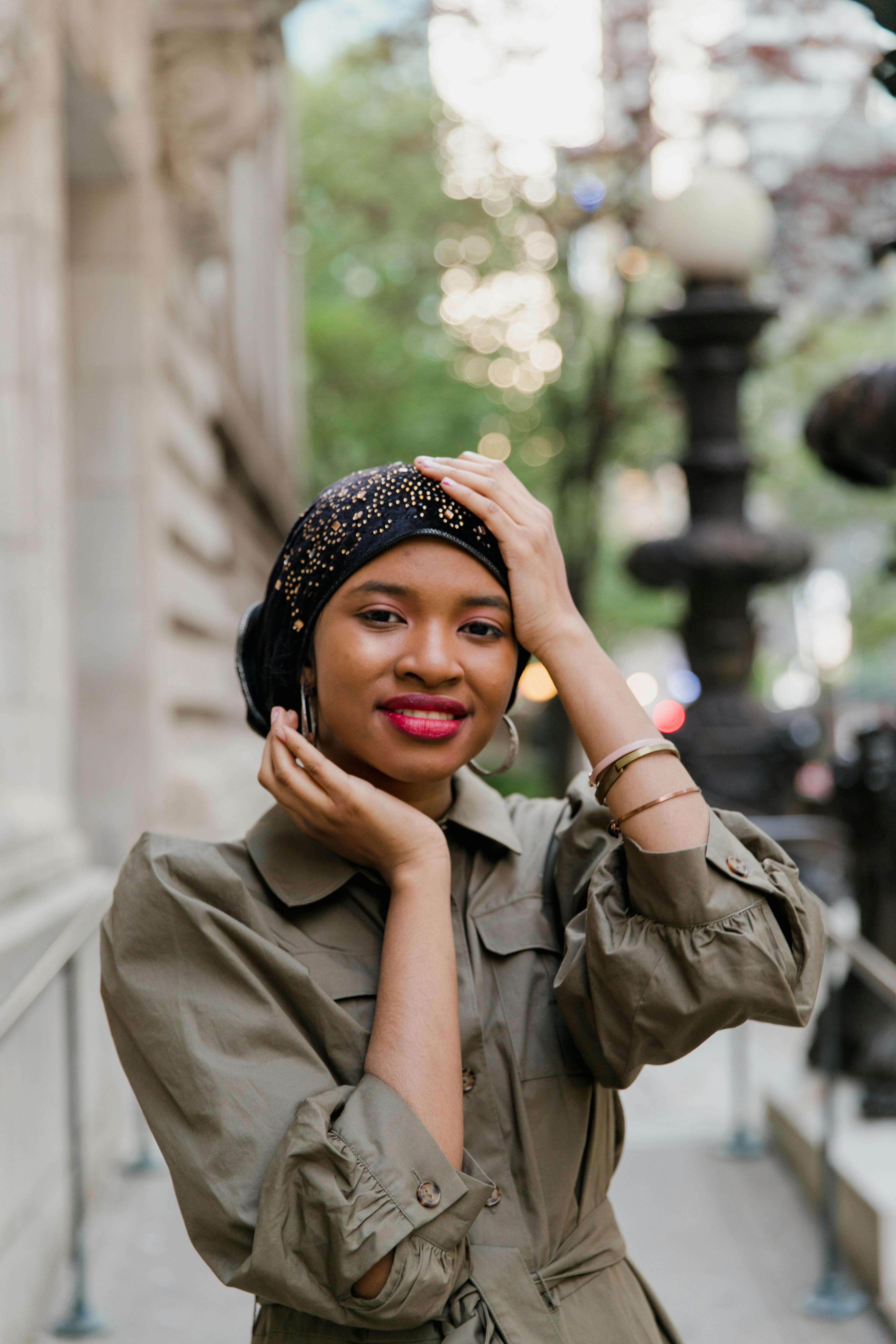 Woman in Gray Coat Wearing Black and White Floral Hijab