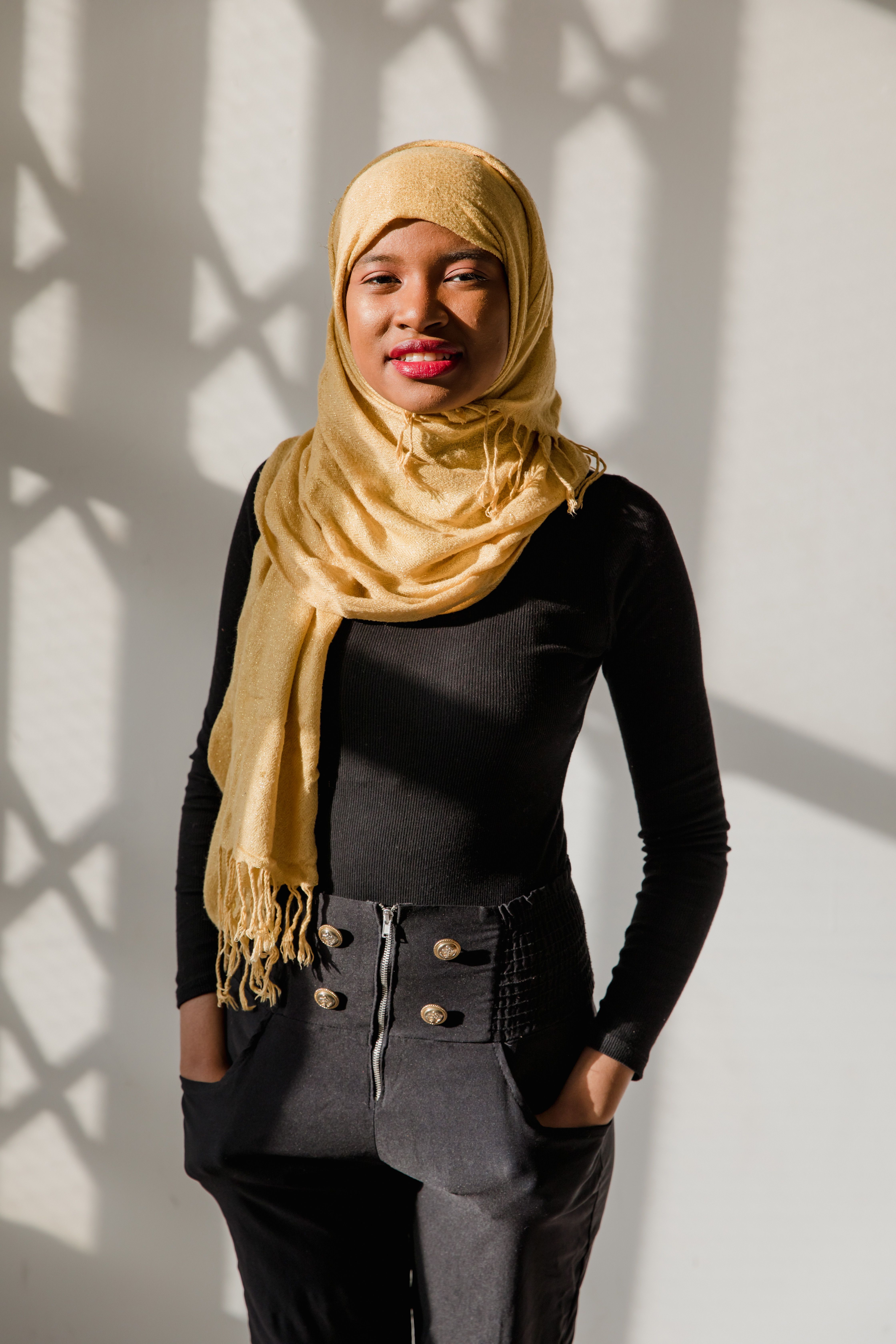 Woman in Yellow Hijab and Black Long Sleeve Shirt · Free Stock Photo