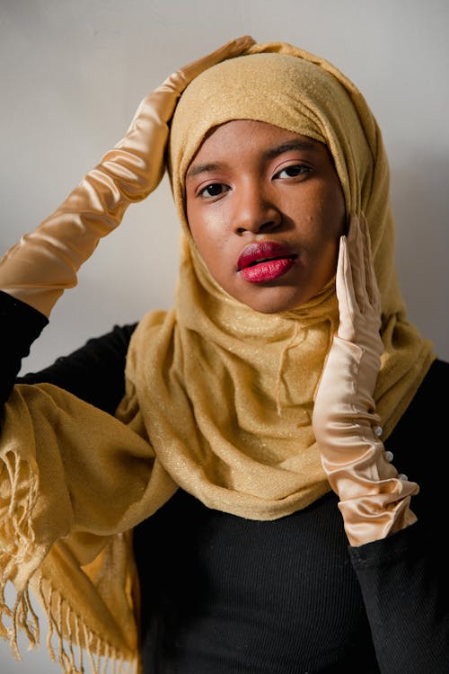 Woman in Beige Hijab and Black Long Sleeve Shirt