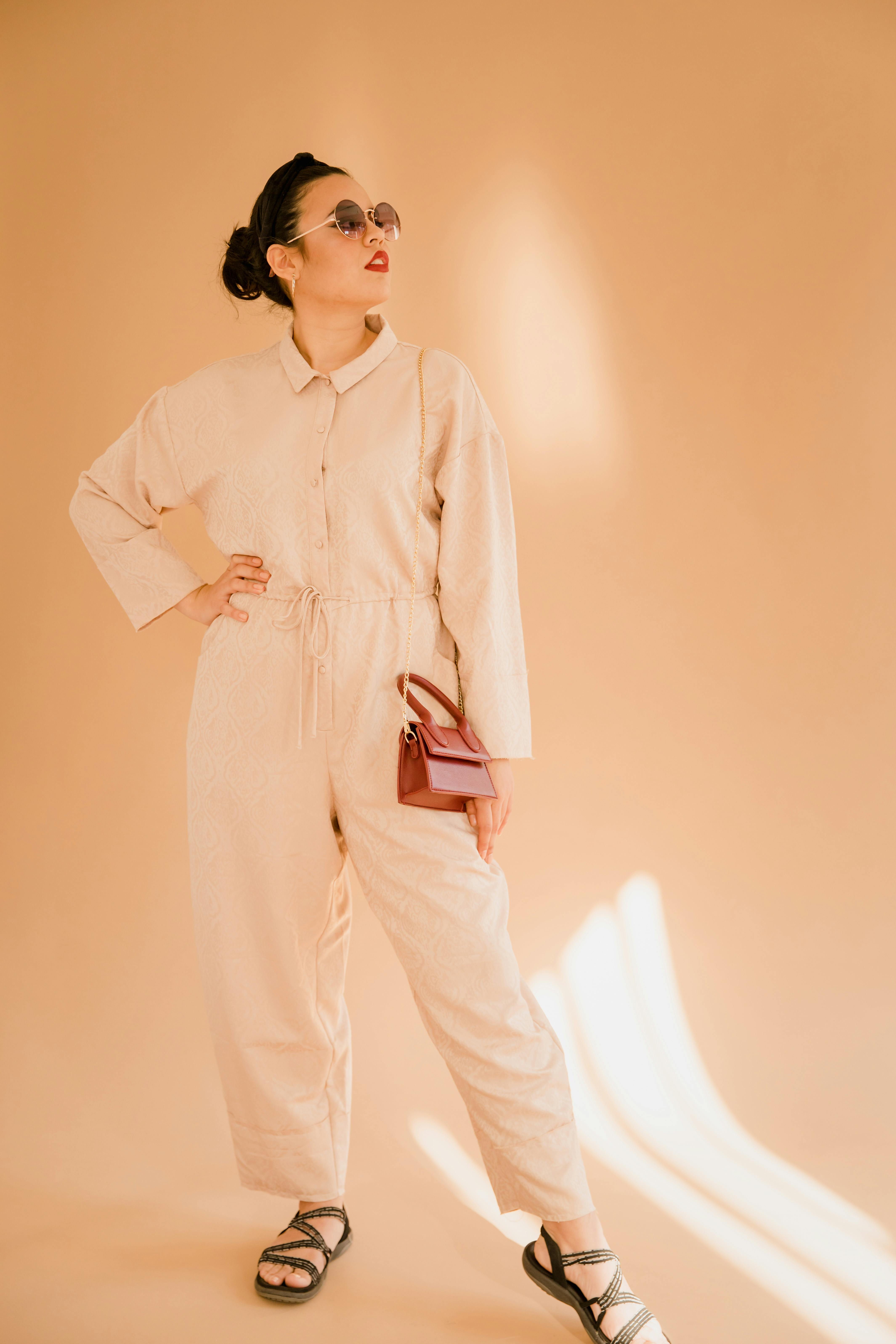 Man in White Dress Shirt and White Pants Standing