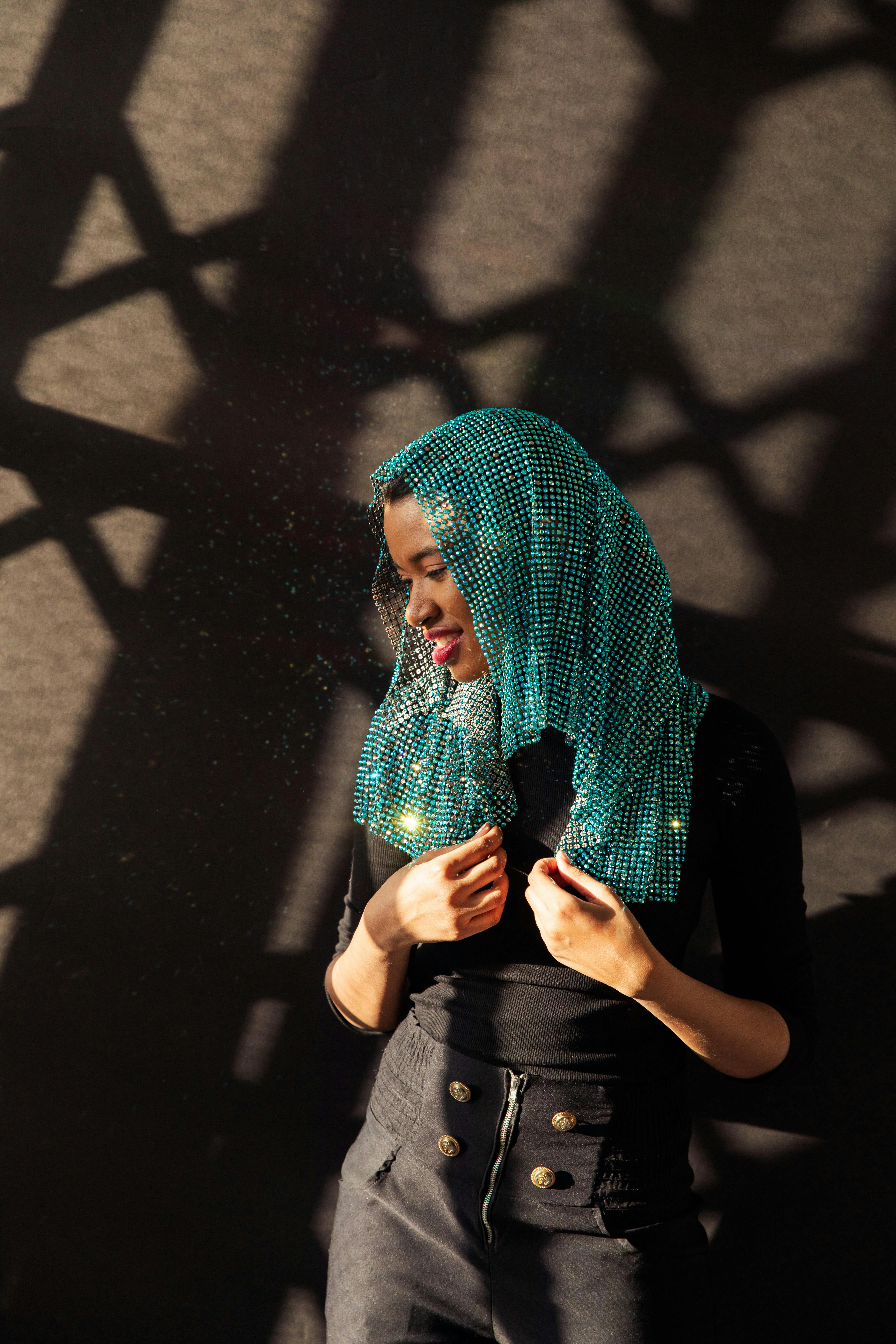 Woman in Black Shirt and Green Scarf