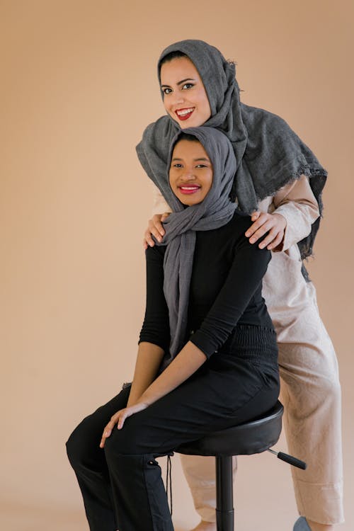 Women Wearing Gray Hijabs Smiling