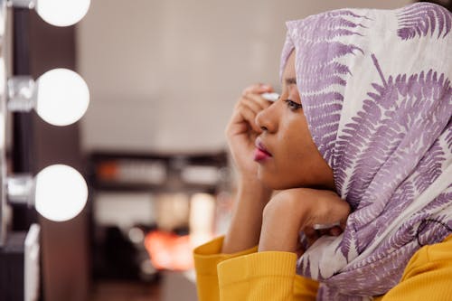 Woman in White and Purple Hijab