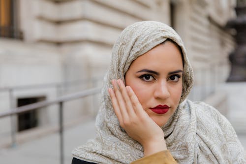 Woman in Beige Hijab and Gray Long Sleeve Shirt