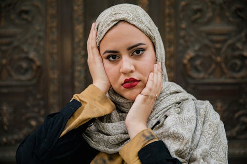 Woman Wearing Hijab Touching her Face