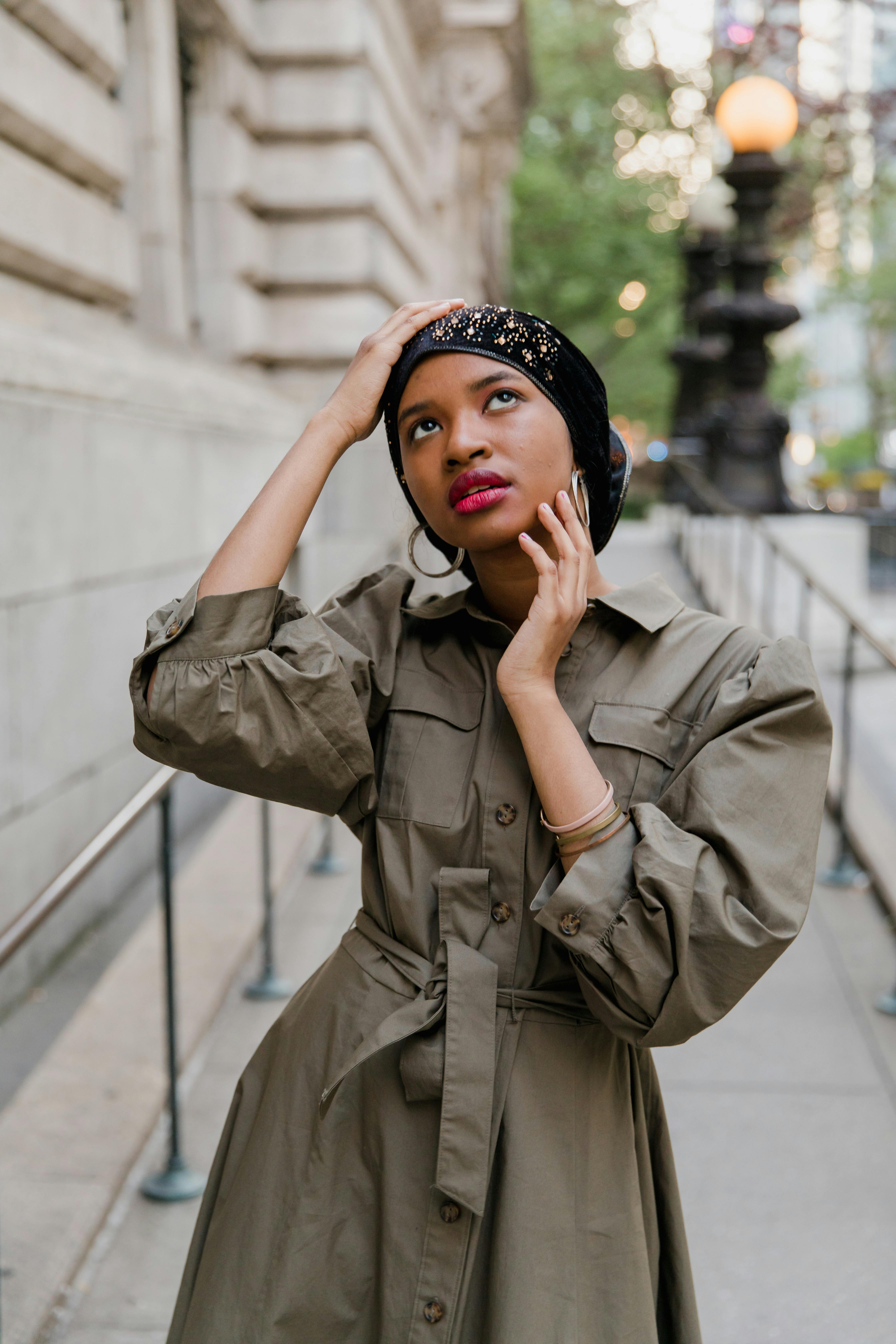 Woman in Brown Coat Wearing Black and White Floral Hijab