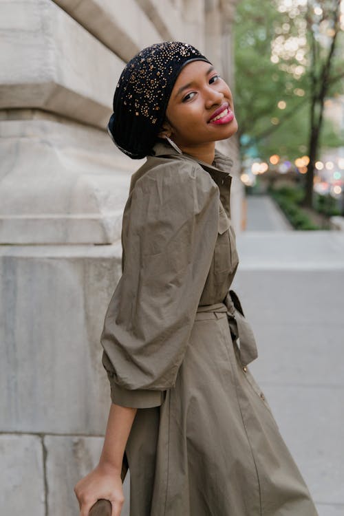 Woman in Brown Coat and Black Knit Cap