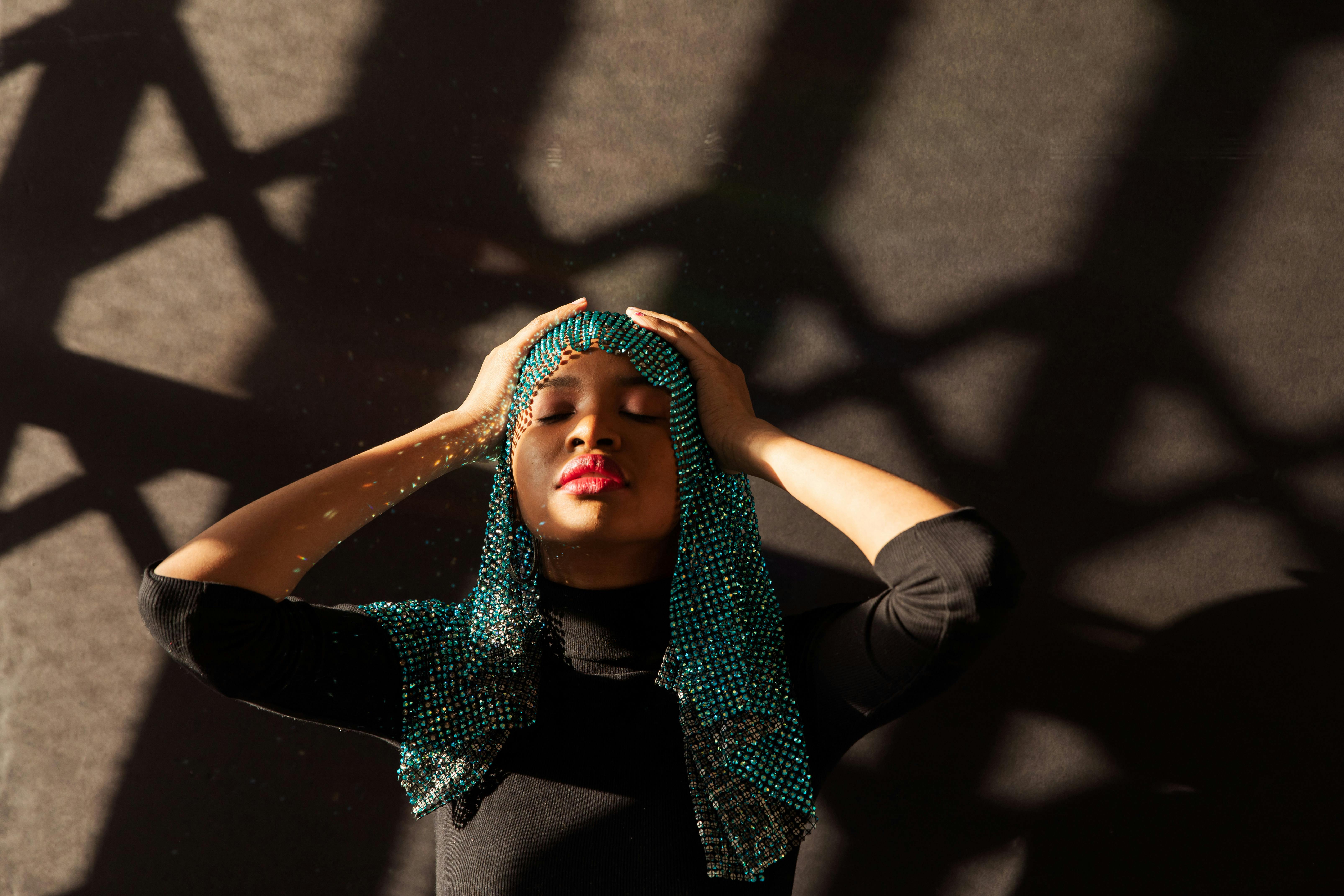 Woman in Green Knit Cap and Black Pants