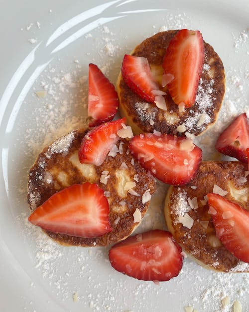 Close-Up Photograph of Pancakes with Slices of Strawberries