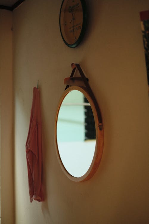 Free Photo of a Mirror Hanging on a Wall Stock Photo