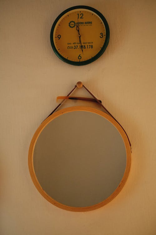 Free Photo of a Mirror Below a Wall Clock Stock Photo