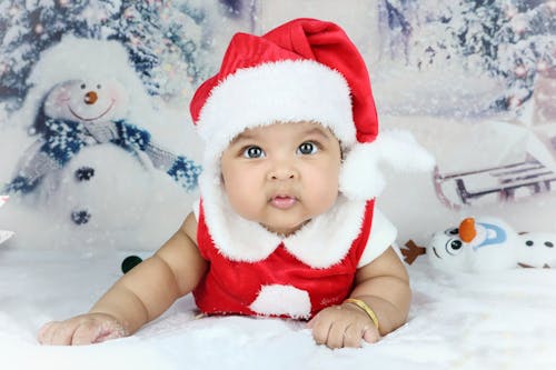 Baby Wearing a Santa Costume