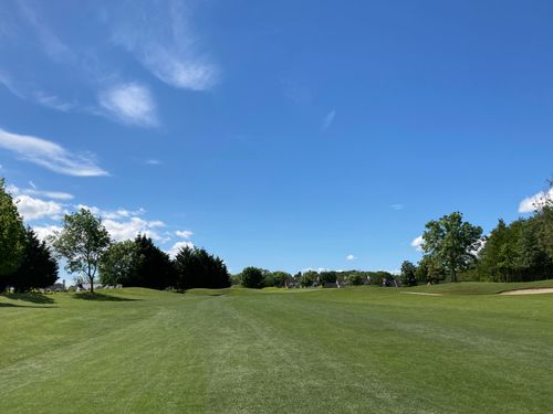 Free Explore a lush green golf course under a bright blue sky in Dublin. Stock Photo