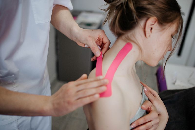 Physiotherapist treating neck pain