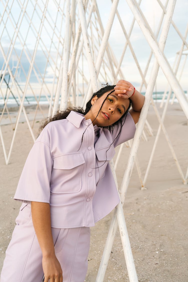 Woman In White Button Up Polo Standing On White Sand