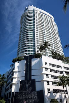 Stunning view of a modern hotel against a bright blue sky in Miami, Florida.