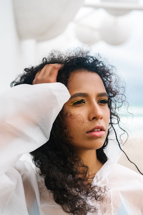 A Woman Wearing a White Raincoat