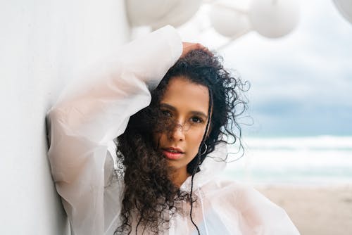 Beautiful Woman Wearing a White Raincoat